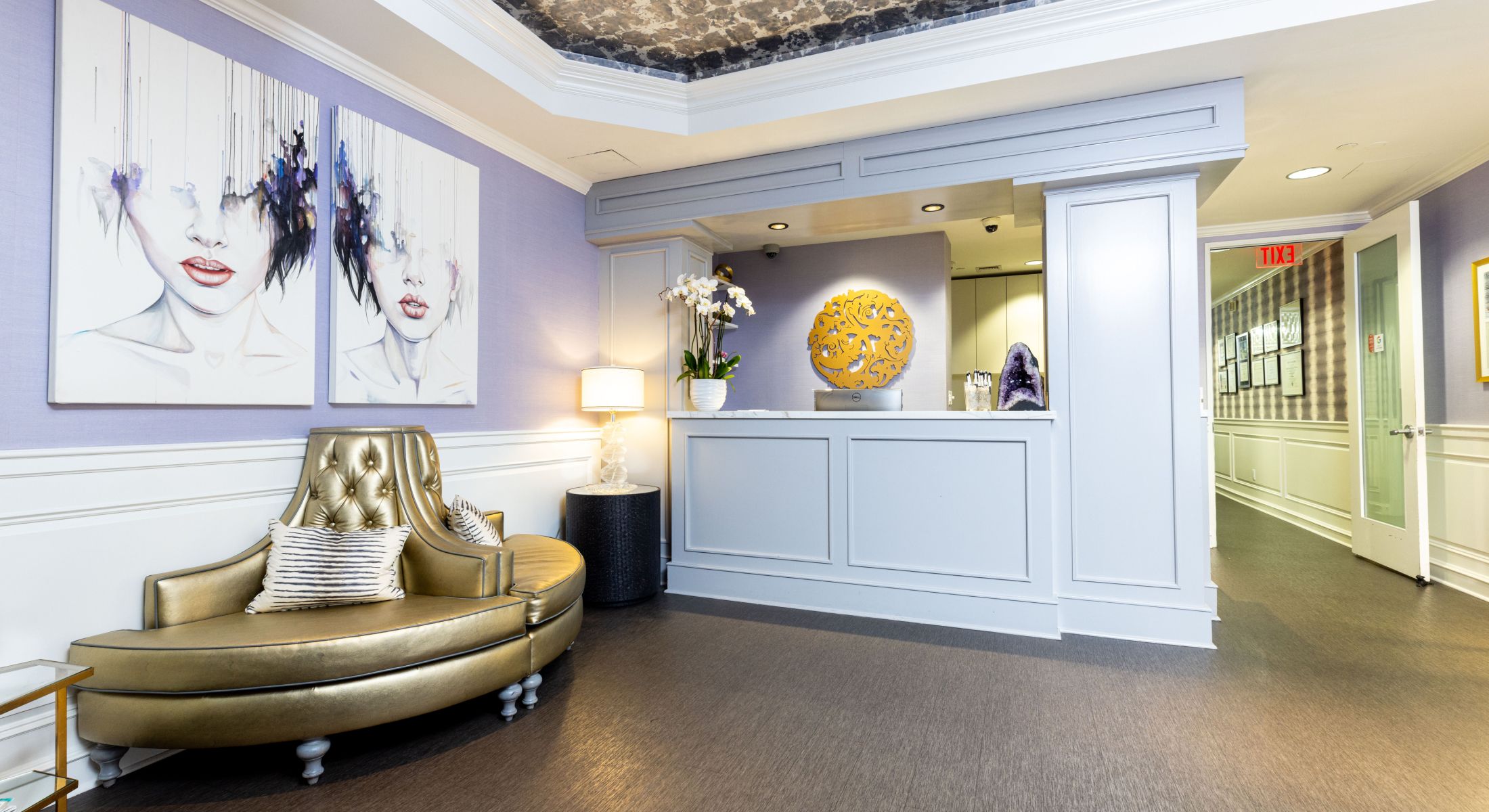 Reception area with artistic wall decor and seating.