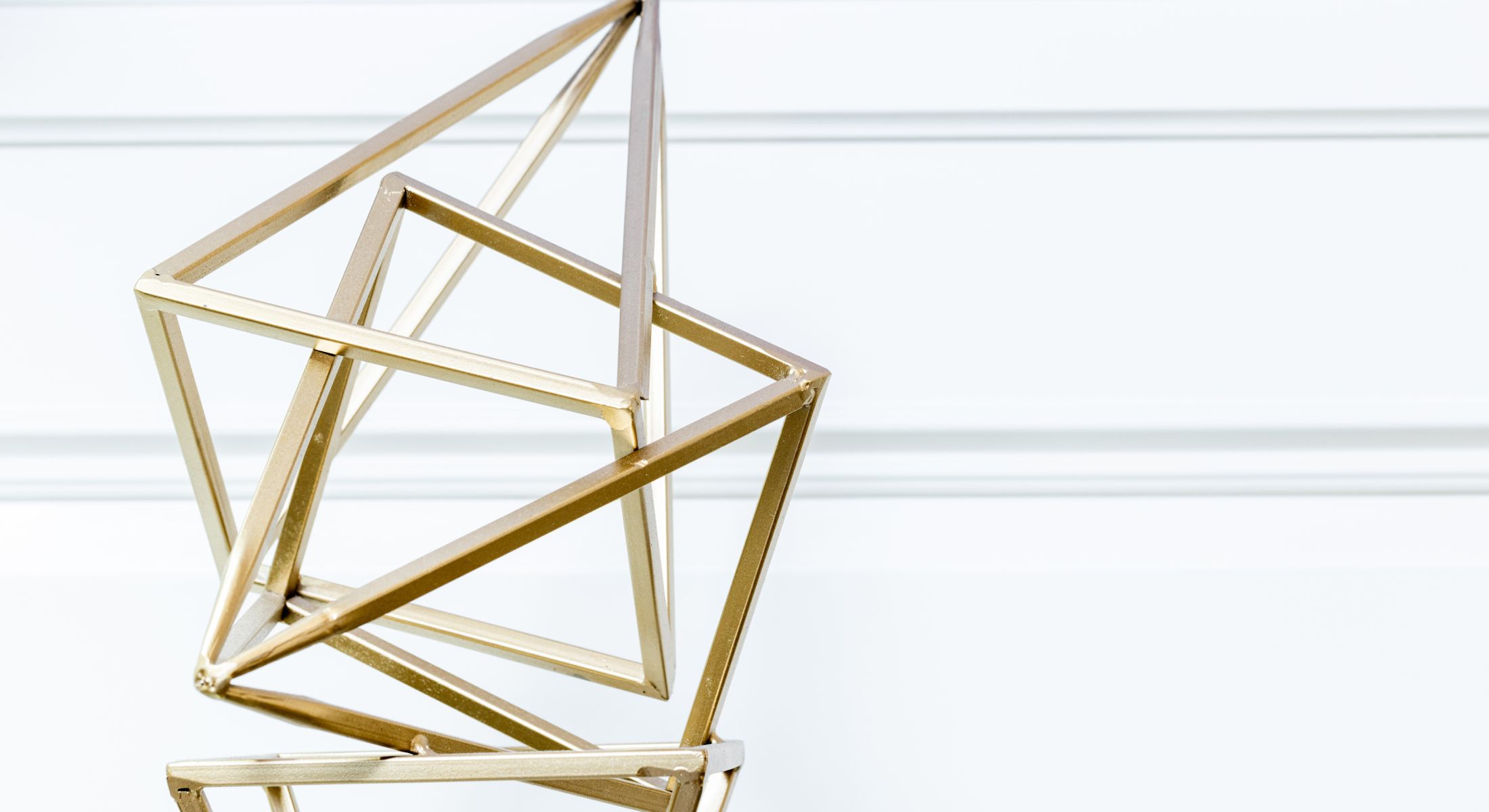 Woman in black outfit against urban backdrop.