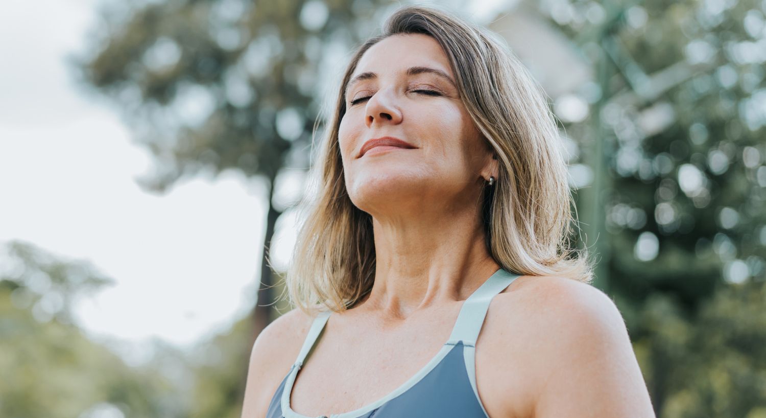 Woman enjoying a moment of peace outdoors.